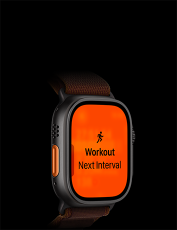 Zegarek z pomarańczowym ekranem wyświetlającym ikonę biegnącej osoby oraz tekst \'Workout Next Interval\'.