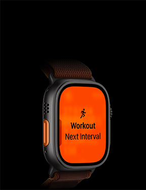 Zegarek z czarną kopertą i bransoletą, na ekranie widoczny pomarańczowy wyświetlacz z ikoną biegnącej osoby oraz tekstem \'Workout Next Interval\'.