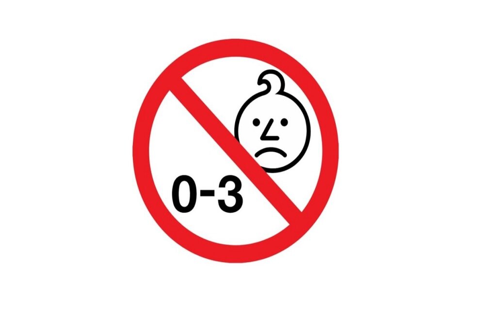 Symbol zakazu z twarzą dziecka i tekstem \'0-3\'.