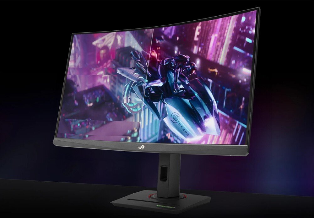 Monitor z zakrzywionym ekranem wyświetla dynamiczną scenę z gry, przedstawiającą futurystyczny motocykl. Na dolnej ramce widoczne jest logo ROG.