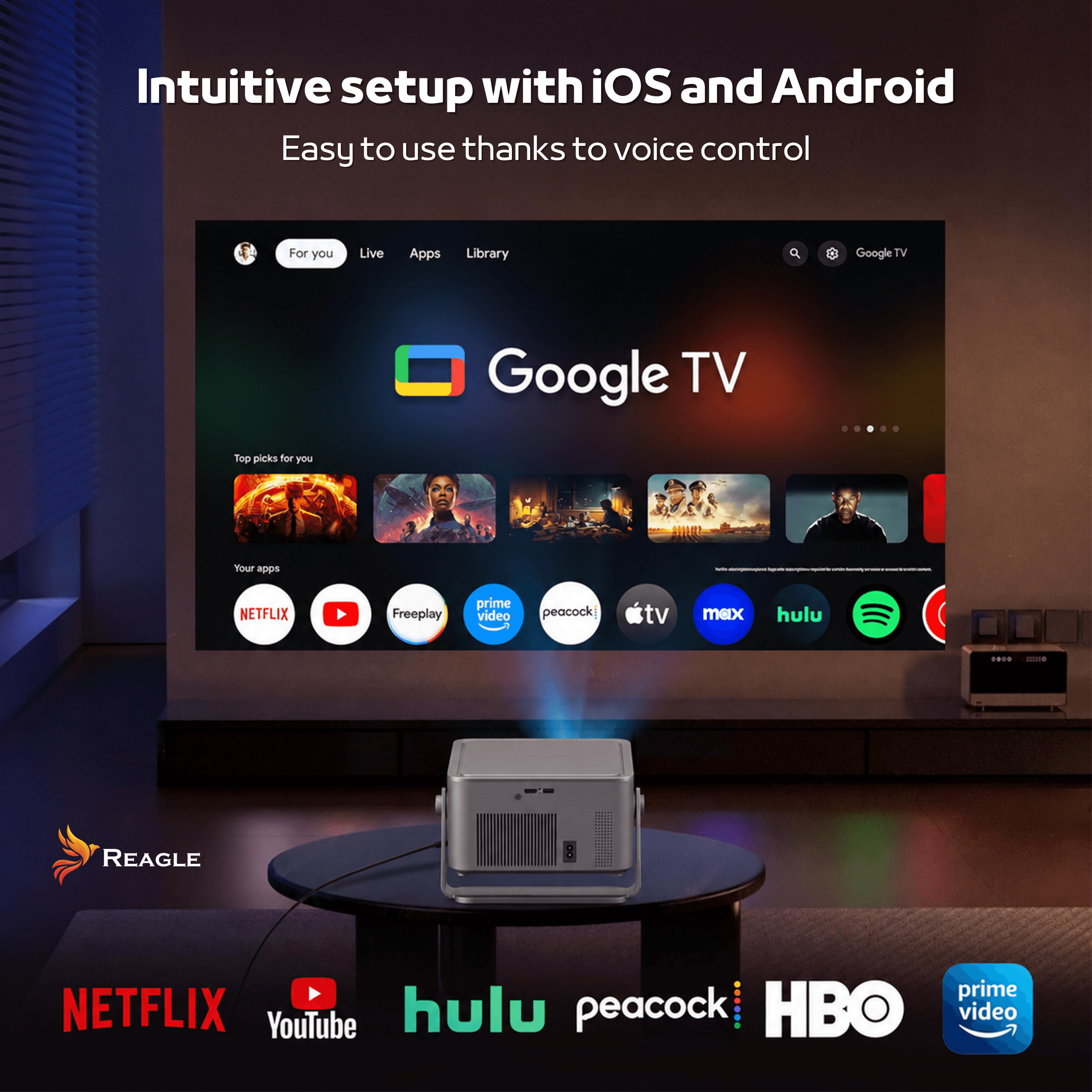 Obraz przedstawia projektor wyświetlający interfejs Google TV na ścianie, z widocznymi ikonami aplikacji takimi jak Netflix, YouTube, Hulu, Peacock, HBO i Prime Video. Na górze widnieje tekst: \'Intuitive setup with iOS and Android Easy to use thanks to voice control\'.