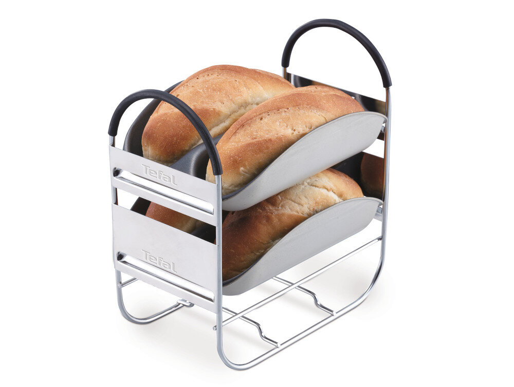 Na obrazie widoczny jest metalowy stojak z dwoma poziomami, na których znajdują się bochenki chleba. Na stojaku widnieje logo \'Tefal\'.
