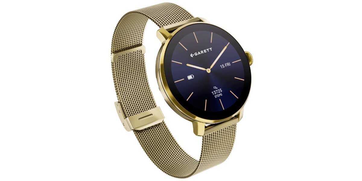 Złoty smartwatch z okrągłą tarczą, na której widnieje logo \'GARETT\' oraz data \'15 FRI\'. Pasek wykonany jest z metalowej siatki.