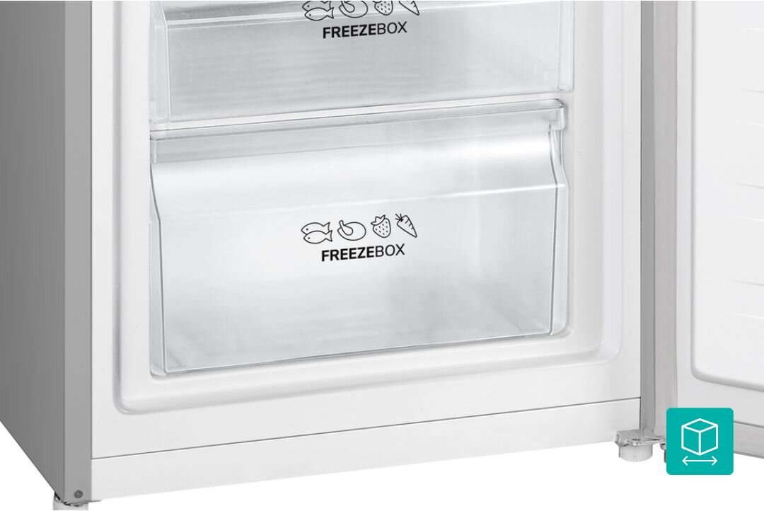 Zdjęcie przedstawia wnętrze zamrażarki z dwoma przezroczystymi szufladami oznaczonymi napisem \'FREEZEBOX\' oraz ikonami ryby, mięsa, truskawki i marchewki. W dolnym rogu widoczna jest zielona ikona z symbolem pudełka.