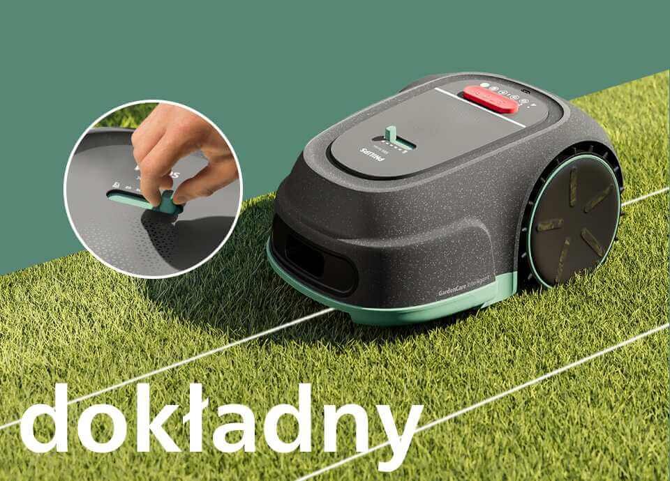 Robot koszący na trawie z widocznym panelem sterowania i przyciskiem. Na obrazie znajduje się tekst: \'dokładny\'.