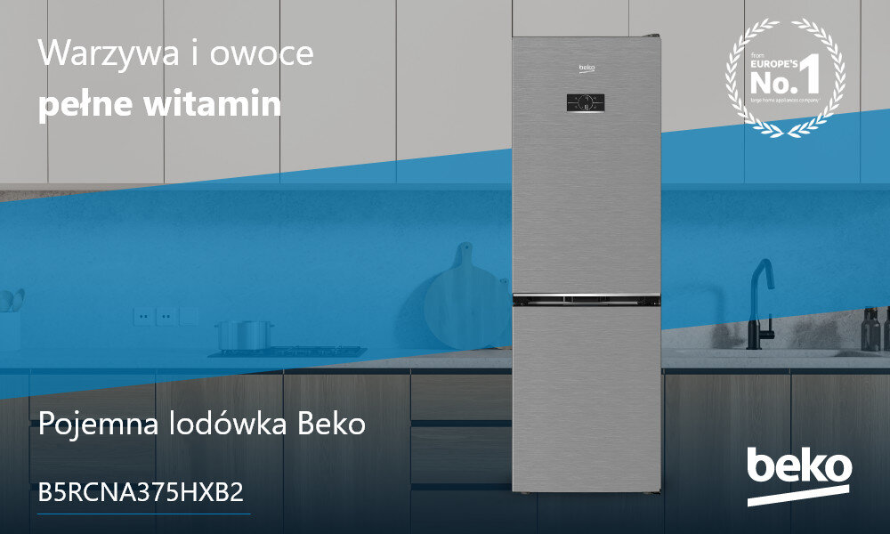Na obrazie znajduje się srebrna lodówka z logo Beko, umieszczona w nowoczesnej kuchni. Widoczny tekst: \'Warzywa i owoce pełne witamin\', \'Pojemna lodówka Beko\', \'B5RCNA375HXB2\', \'Europe\'s No.1\'.
