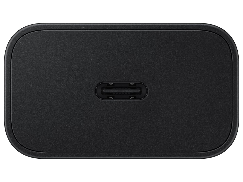 Czarna ładowarka sieciowa z portem USB-C na środku. Powierzchnia jest gładka i matowa.