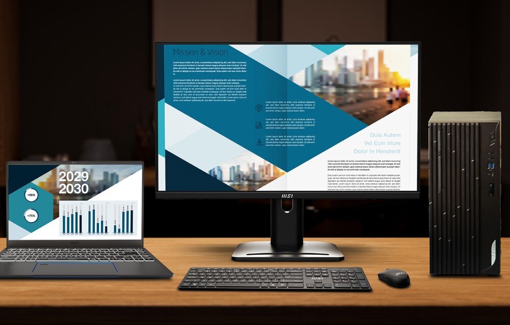 Na biurku znajduje się monitor MSI z wyświetlonym dokumentem, obok laptop z wykresami i datą 2029-2030 oraz komputer stacjonarny. Na monitorze widoczne jest logo MSI.