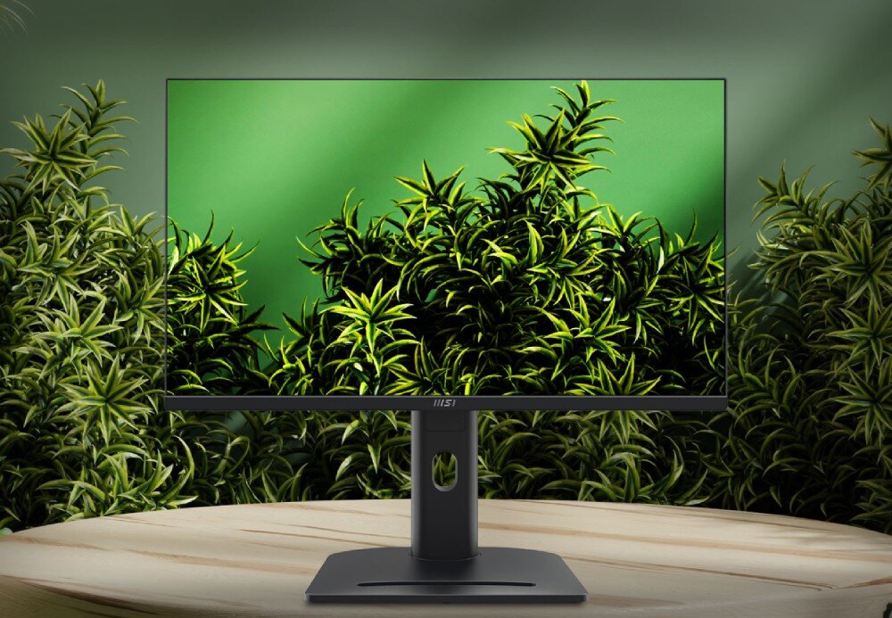 Monitor z cienkimi ramkami wyświetla obraz zielonych roślin na tle. Na podstawie monitora widoczne jest logo \'MSI\'.