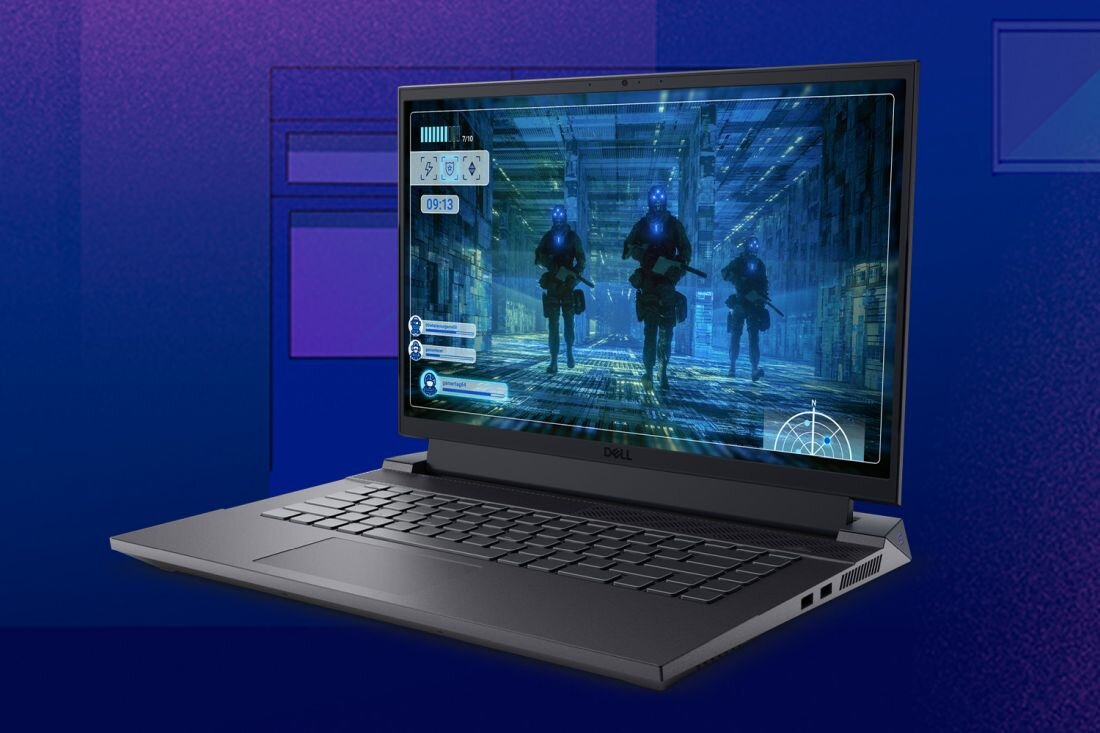 Laptop z wyświetlaczem pokazującym grę wideo z trzema postaciami w futurystycznym otoczeniu. Na obudowie widoczne jest logo \'Dell\'.
