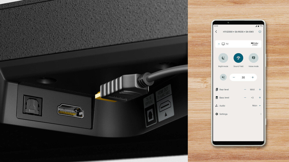 Obraz przedstawia złącza HDMI i optyczne na urządzeniu oraz ekran smartfona z aplikacją do sterowania dźwiękiem. Na ekranie widoczne są opcje takie jak \'Night mode\', \'Sound Field\', \'Voice mode\', oraz ustawienia poziomu dźwięku i basu.