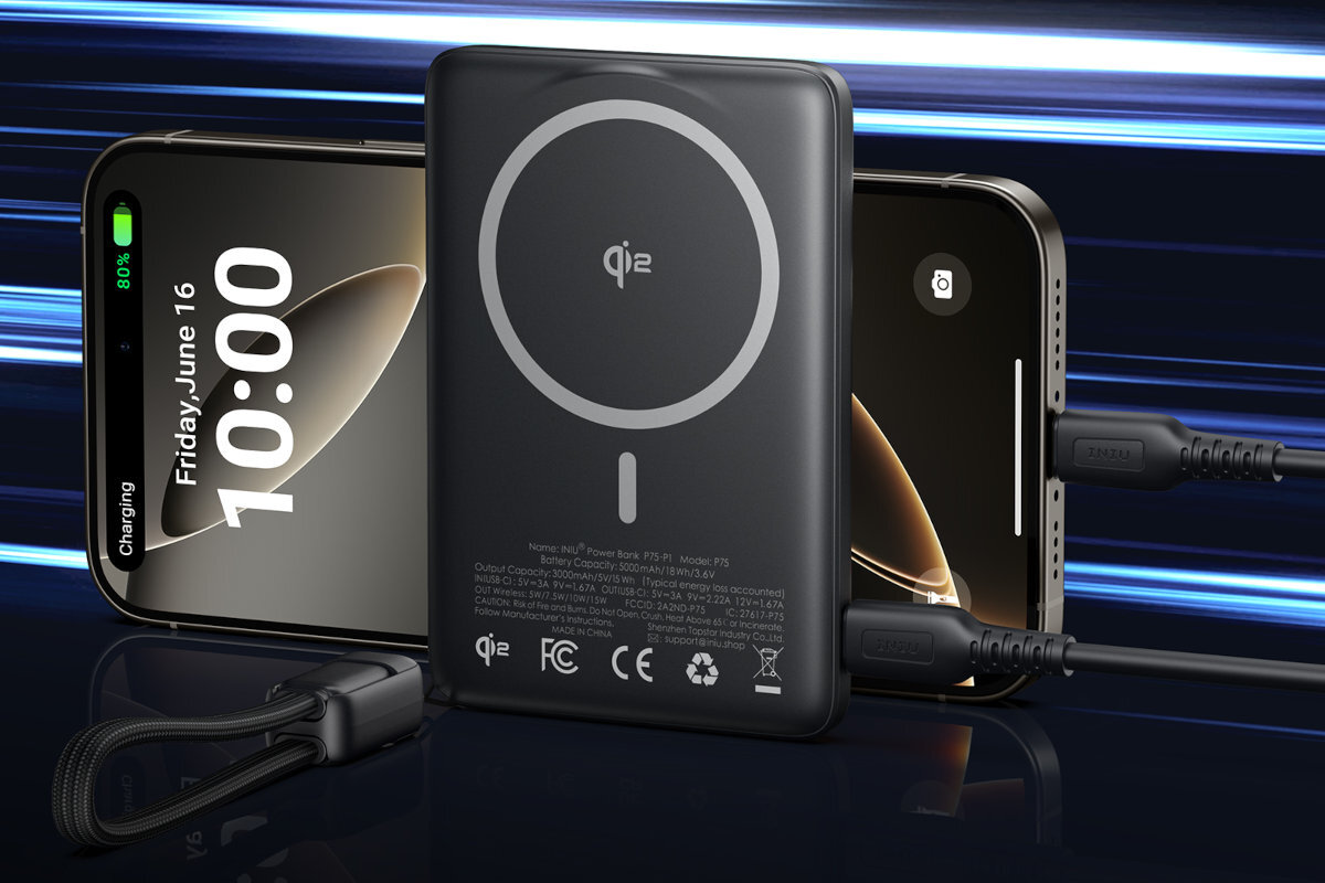 Na obrazie widoczny jest czarny powerbank z okrągłym symbolem i napisem \'qi2\' na powierzchni. Obok niego znajdują się dwa smartfony, jeden z wyświetlaczem pokazującym godzinę 10:00 i datę piątek, 16 czerwca, z ikoną ładowania naładowaną do 80%.