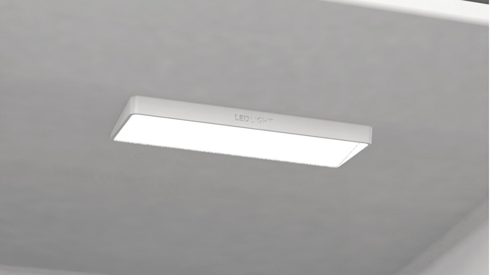 Prostokątne źródło światła LED zamontowane na suficie wnętrza lodówki. Na obudowie widoczny jest napis \'LED LIGHT\'.