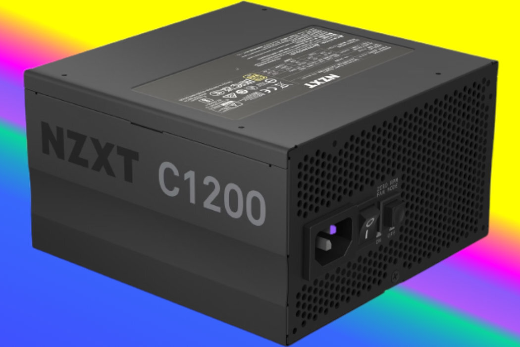 Czarny zasilacz komputerowy z widocznym napisem \'NZXT C1200\' oraz perforowaną powierzchnią z tyłu. Tło jest kolorowe, z gradientem żółto-różowym.