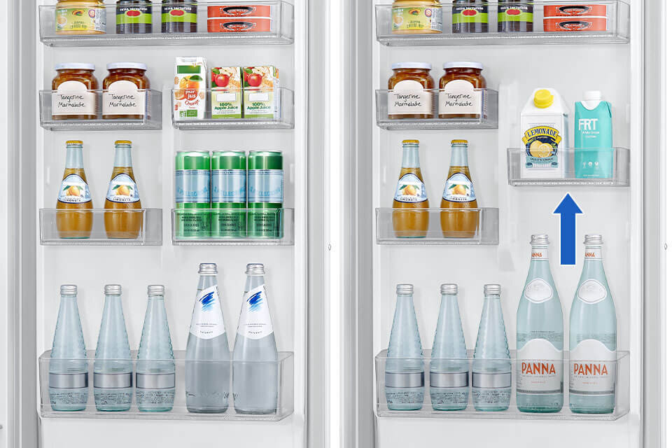Wnętrze lodówki z różnorodnymi produktami spożywczymi, w tym słoikami z dżemem, kartonami soku, butelkami wody i napojami gazowanymi. Na drzwiach lodówki widoczna jest niebieska strzałka wskazująca na karton z napisem \'LEMONADE\'.