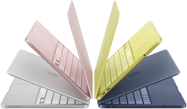 Cztery laptopy w różnych kolorach: różowym, żółtym, niebieskim i srebrnym, ustawione w formie wachlarza. Każdy laptop ma widoczną klawiaturę i ekran.