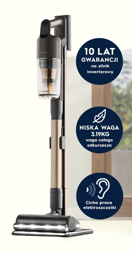 Odkurzacz pionowy z przezroczystym pojemnikiem na kurz i metaliczną rurą. Na obrazie widoczne są napisy: \'10 LAT GWARANCJI na silnik inwerterowy\', \'NISKA WAGA 3.19KG waga całego odkurzacza\', \'Cicha praca elektroszczotki\'.