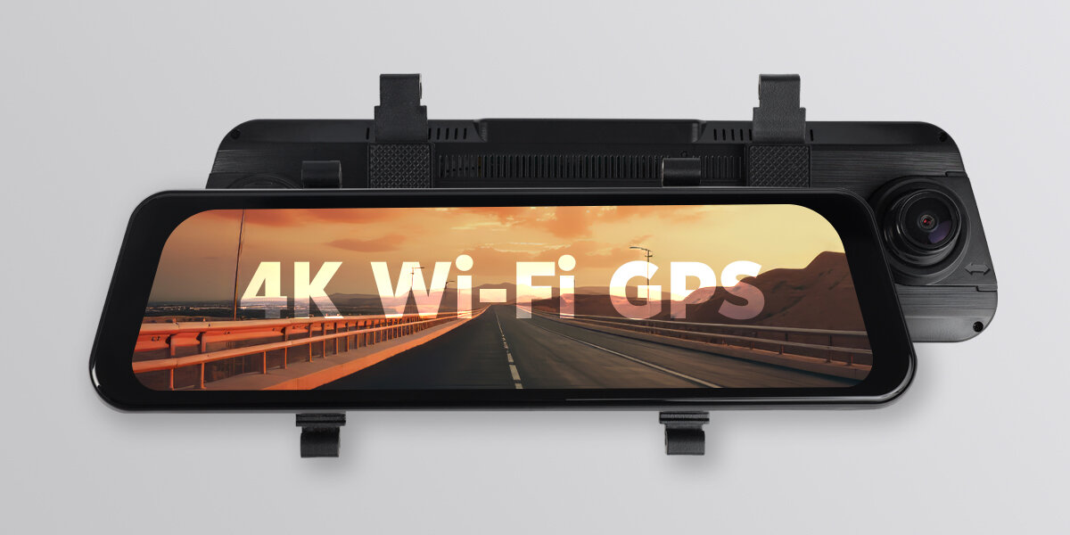 Obraz przedstawia wideorejestrator z wyświetlaczem, na którym widoczny jest napis \'4K Wi-Fi GPS\' oraz droga w tle. Urządzenie ma kamerę po prawej stronie.