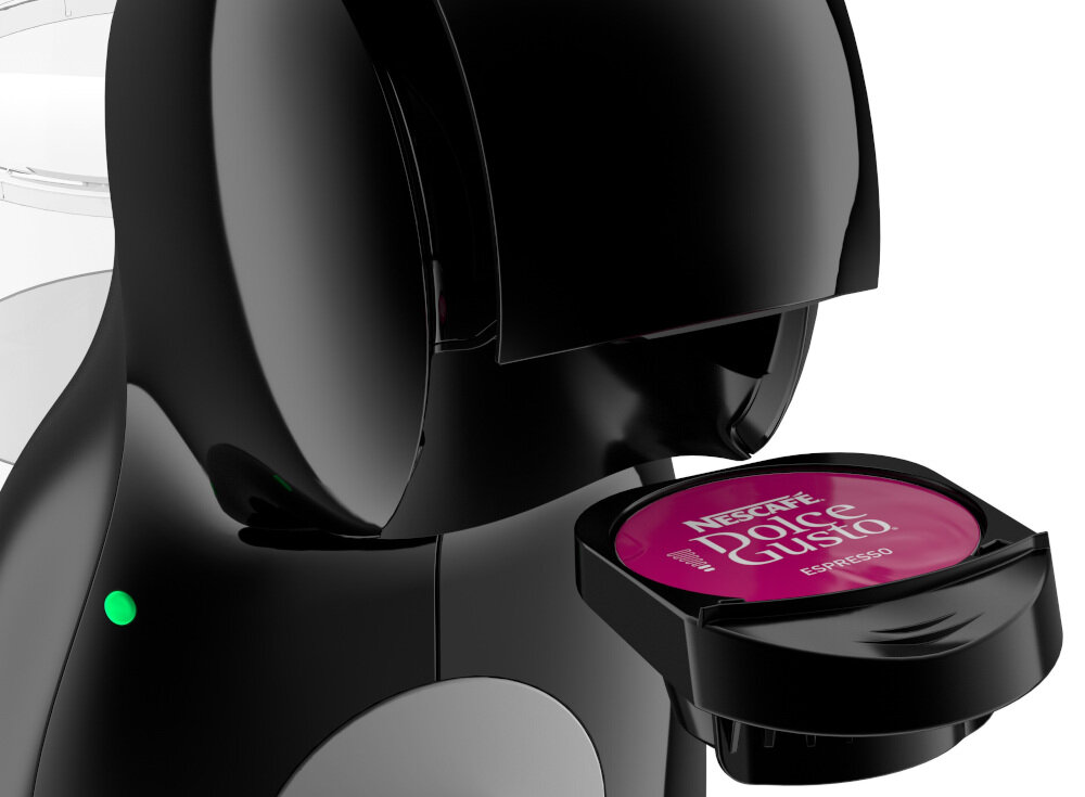 Czarny ekspres do kawy z widoczną kapsułką o nazwie \'NESCAFÉ Dolce Gusto Espresso\'.