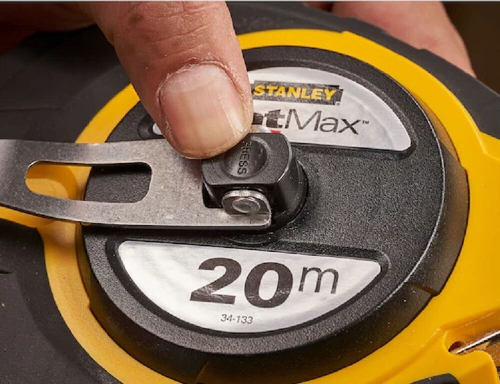 Miara zwijana STANLEY 0-34-133 (20 m), korbka, zwijanie, prowadnice, mechanizm, palec reguluje korbkę miarki