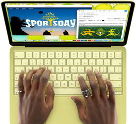 Osoba pisze na klawiaturze laptopa w kolorze jasnozielonym. Na ekranie widoczne są dwie aplikacje: jedna z napisem \'Sports Day\', druga z tekstem i grafiką.
