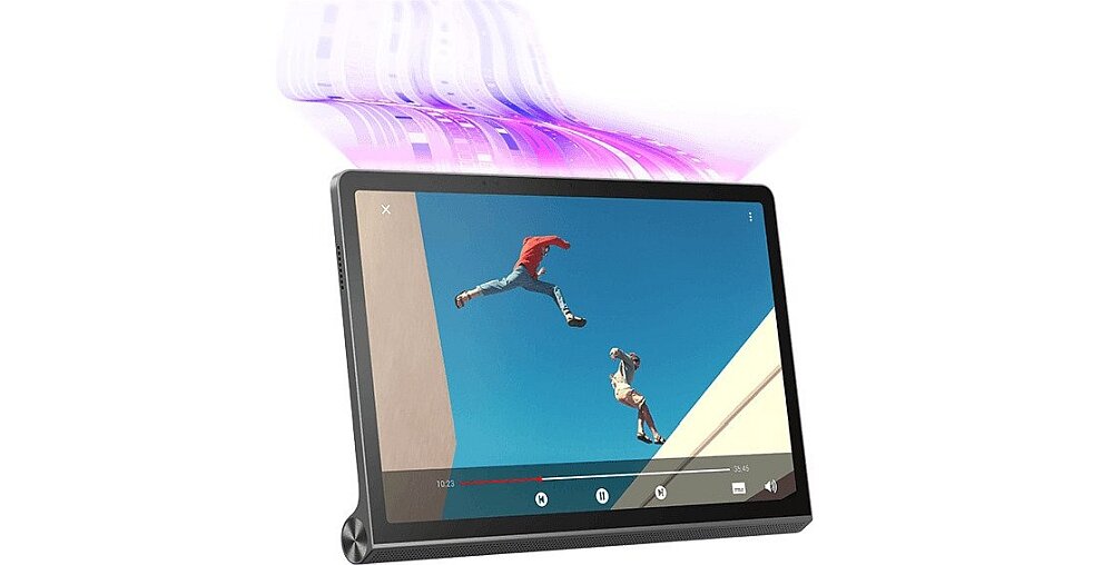 Tablet z wyświetlaczem pokazującym dwie osoby skaczące między budynkami na tle nieba. Nad tabletem widoczny jest efekt świetlny w kolorze fioletowym.