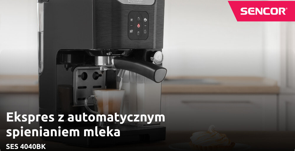 Na obrazie widoczny jest ekspres do kawy z automatycznym spienianiem mleka, z filiżanką pod dyszą. W prawym górnym rogu znajduje się logo \'SENCOR\', a na dole tekst \'Ekspres z automatycznym spienianiem mleka SES 4040BK\'.