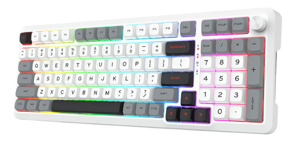 Klawiatura mechaniczna z białymi i szarymi klawiszami, posiadająca podświetlenie RGB oraz pokrętło w prawym górnym rogu. Widoczne są klawisze numeryczne, strzałki oraz klawisze funkcyjne od F1 do F12.