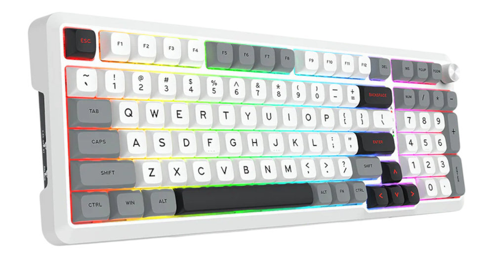 Klawiatura mechaniczna z białą obudową i podświetleniem RGB, posiada klawisze w kolorach białym i szarym. Widoczne są klawisze funkcyjne, numeryczne oraz specjalne, takie jak ESC i ENTER.