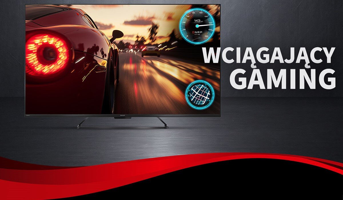 Telewizor wyświetla dynamiczną scenę z gry wyścigowej, a obok widoczny jest napis \'WCIĄGAJĄCY GAMING\'.