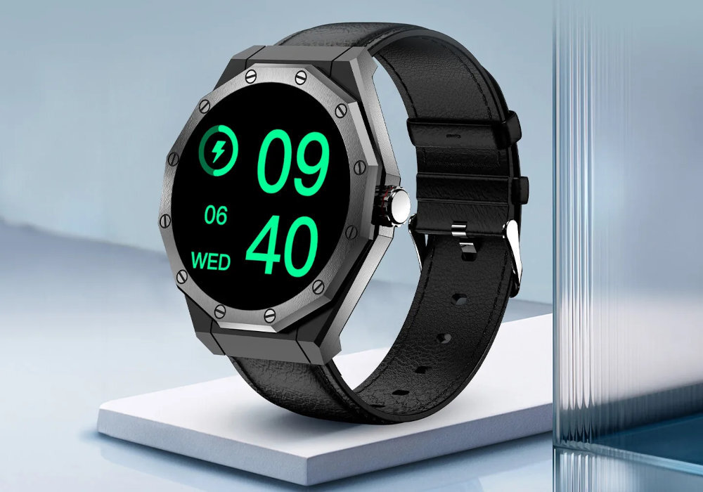 Smartwatch z metalową kopertą i czarnym paskiem, wyświetlający godzinę 09:40 oraz datę 06 WED na czarnym tle z zielonymi cyframi.