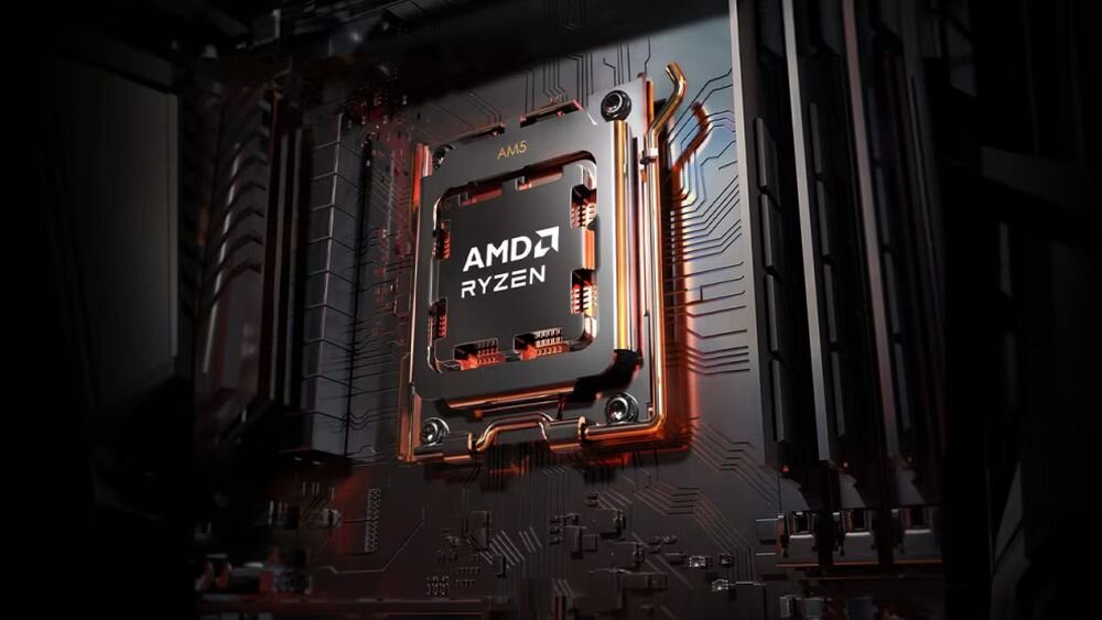 Obraz przedstawia procesor zamontowany na płycie głównej z widocznym logo \'AMD RYZEN\'. Procesor jest otoczony przez elementy elektroniczne i ma oznaczenie \'AM5\'.