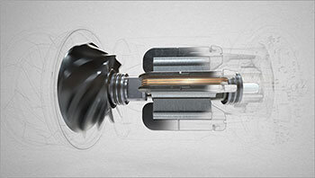 Obraz przedstawia przekrój mechanizmu z wirującym elementem po lewej stronie i cylindrycznymi komponentami po prawej stronie.
