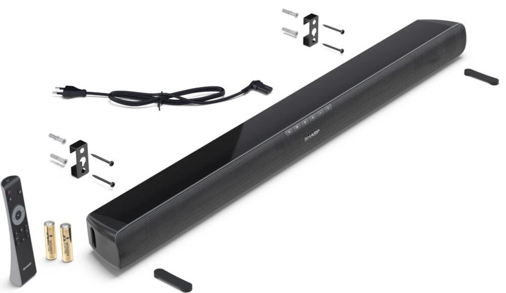 Czarny soundbar z widocznym logo \'SHARP\', otoczony akcesoriami montażowymi, pilotem, bateriami i kablem zasilającym. Produkt przeznaczony do montażu na ścianie.