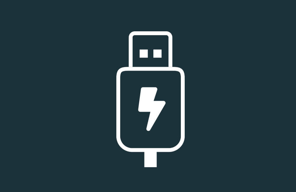 Ikona przedstawia biały symbol USB z błyskawicą na ciemnym tle, sugerujący funkcję ładowania.