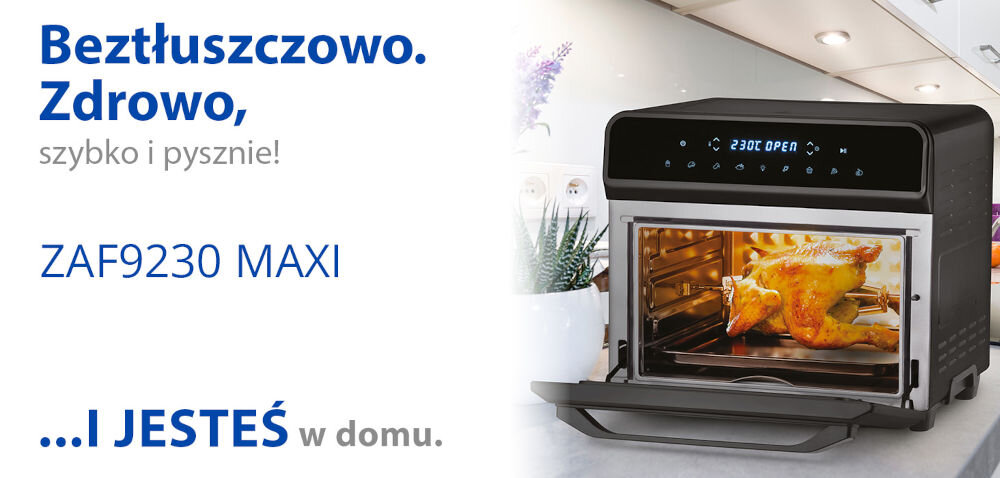 Obraz przedstawia frytkownicę beztłuszczową z okienkiem, w której znajduje się pieczony kurczak. Obok widoczny jest tekst: \'Beztłuszczowo. Zdrowo, szybko i pysznie! ZAF9230 MAXI ...I JESTEŚ w domu.\'