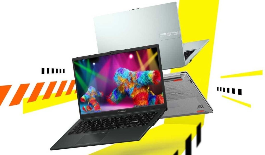 Na obrazie widoczny jest laptop z kolorowym wyświetlaczem, na którym pokazane są wielobarwne postacie. W tle znajdują się elementy graficzne w kolorach żółtym, pomarańczowym i czarnym.