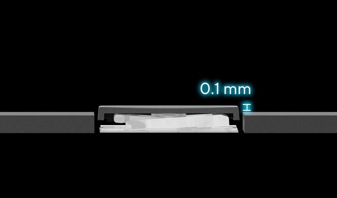 Grafika przedstawia przekrój mechanizmu klawiatury z oznaczeniem \'0.1 mm\' w kolorze niebieskim na czarnym tle.
