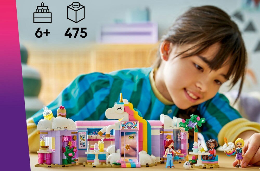 Na obrazie widoczny jest zestaw LEGO przedstawiający kolorową kawiarnię z motywem jednorożca, zbudowany z klocków. W lewym górnym rogu znajduje się tekst: \'6+\' oraz \'475\'.