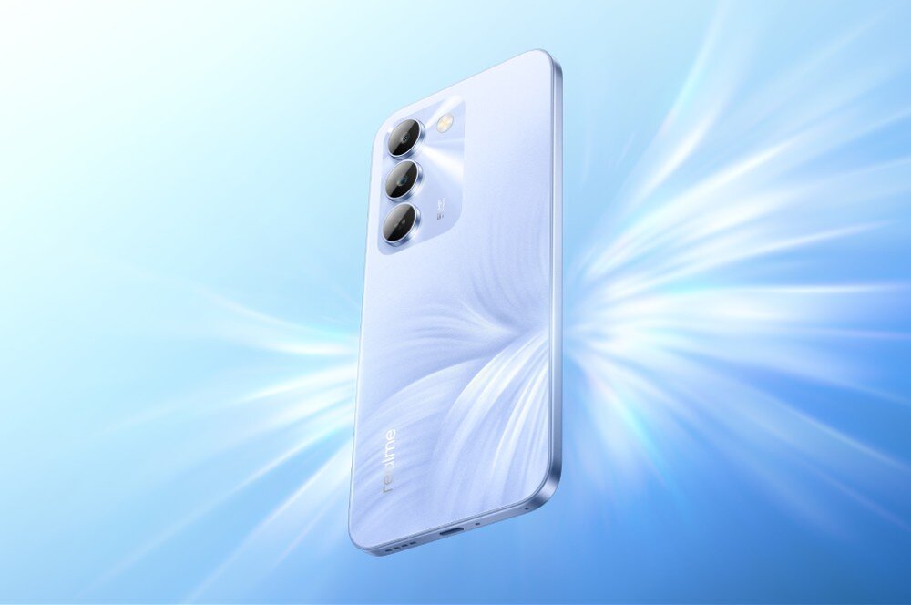 Smartfon REALME C100 5G Smartfon widziany od strony tylnego panelu z widocznymi trzema obiektywami na tle rozchodzących się promieni