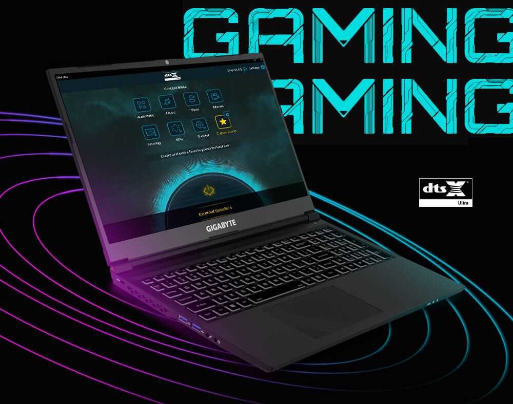 Na obrazie widoczny jest laptop z logo GIGABYTE, z otwartym ekranem wyświetlającym interfejs użytkownika. W tle znajduje się napis \'GAMING\' oraz logo \'dts Ultra\'.