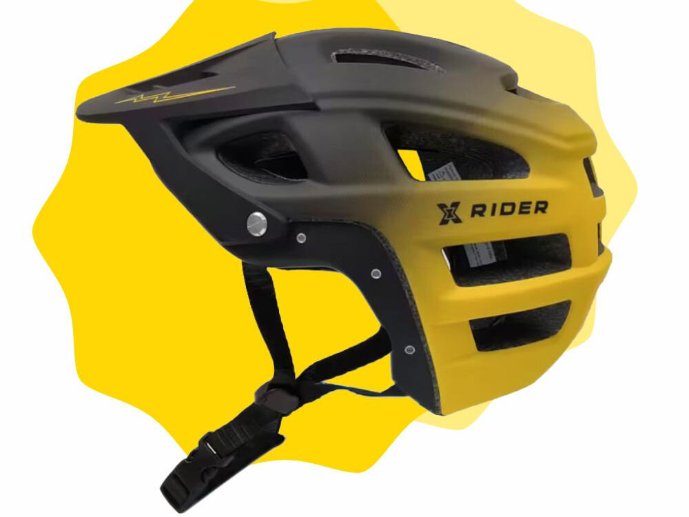 Kask rowerowy w kolorze czarno-żółtym z odkręcaną szczęką, posiada otwory wentylacyjne i napis \'X RIDER\' na boku. Tło jest żółte z nieregularnym kształtem.