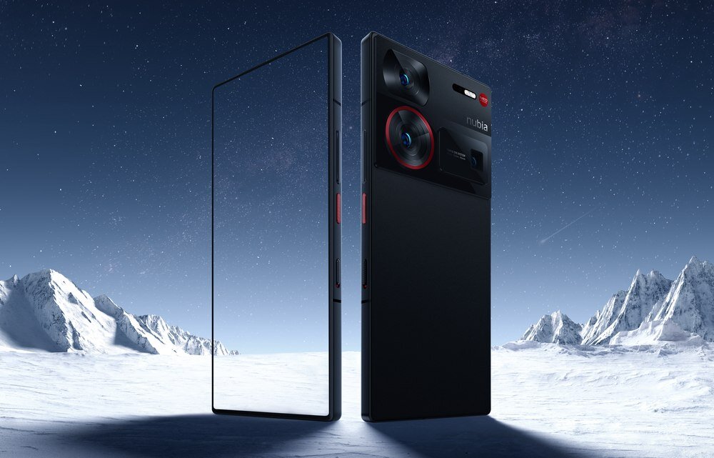 Na obrazie widoczny jest czarny smartfon z dużym ekranem i trzema aparatami z tyłu, umieszczony na tle ośnieżonych gór. Na obudowie znajduje się logo \'nubia\'.