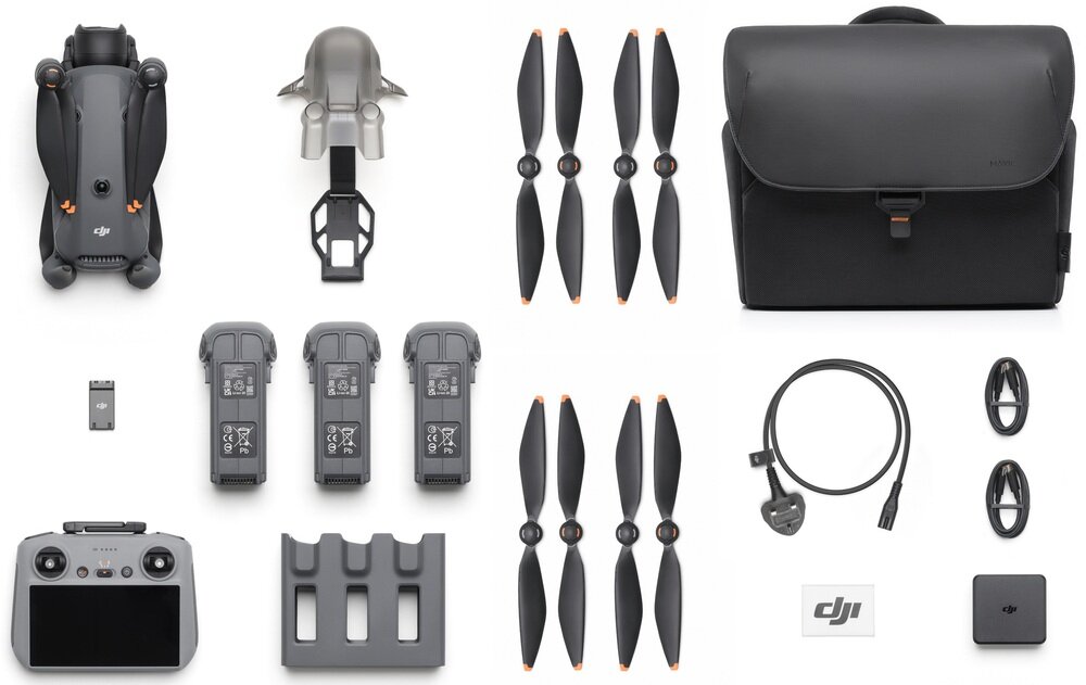 Na obrazie widoczny jest zestaw akcesoriów do drona, w tym dron, kontroler, trzy baterie, śmigła, torba, kabel oraz inne elementy. Logo \'DJI\' jest widoczne na kilku produktach.