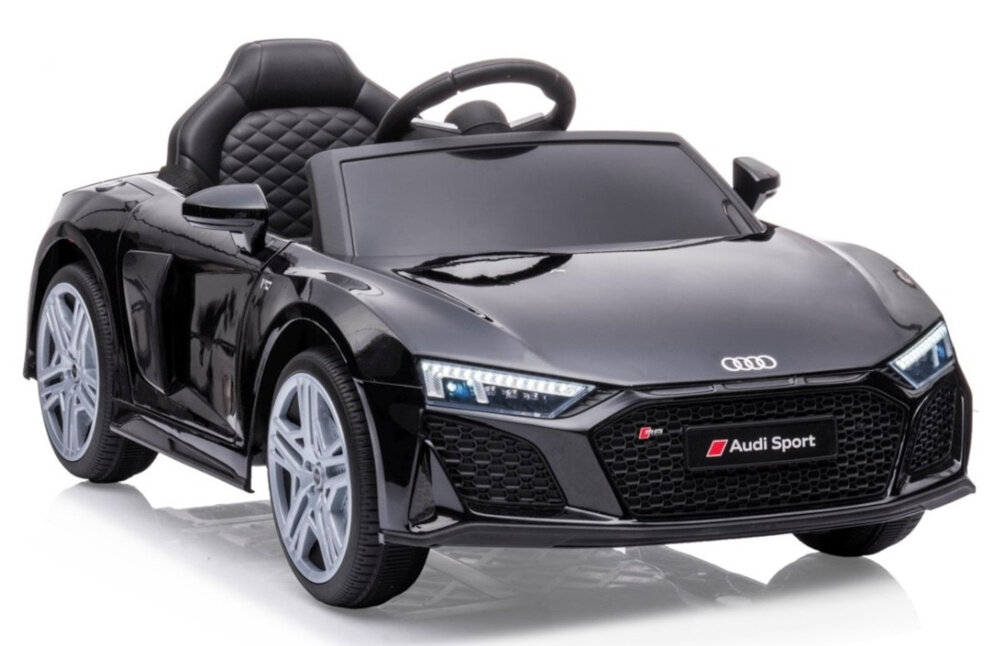 Czarny dziecięcy samochód elektryczny stylizowany na sportowy model, z logo Audi na przodzie i napisem \'Audi Sport\' na kratce chłodnicy.