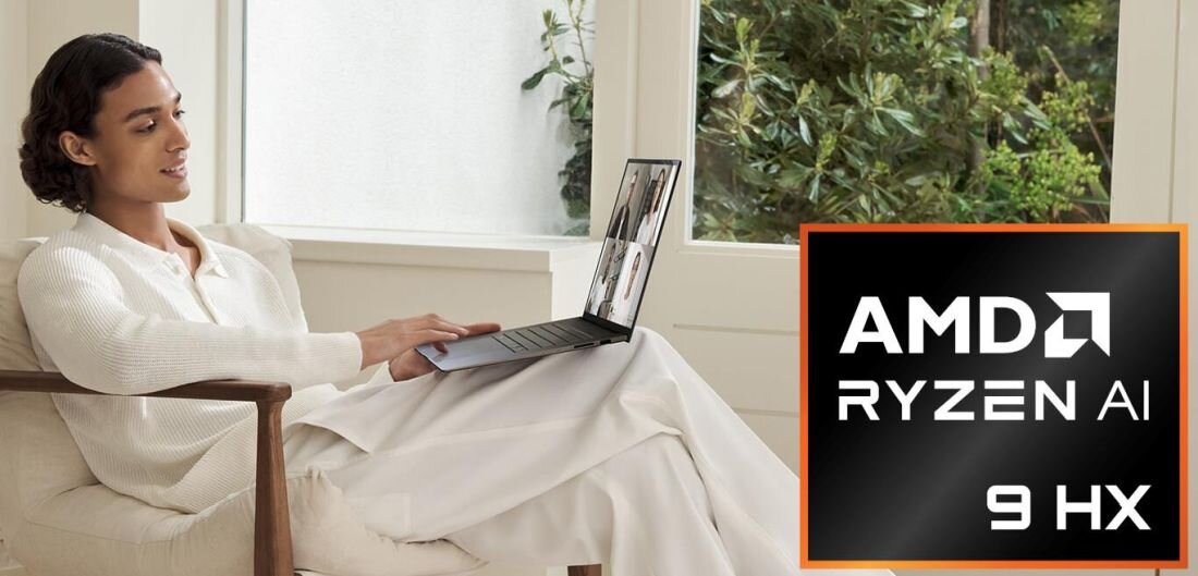 Osoba siedzi na fotelu z laptopem na kolanach, a obok widoczny jest napis \'AMD RYZEN AI 9 HX\'.