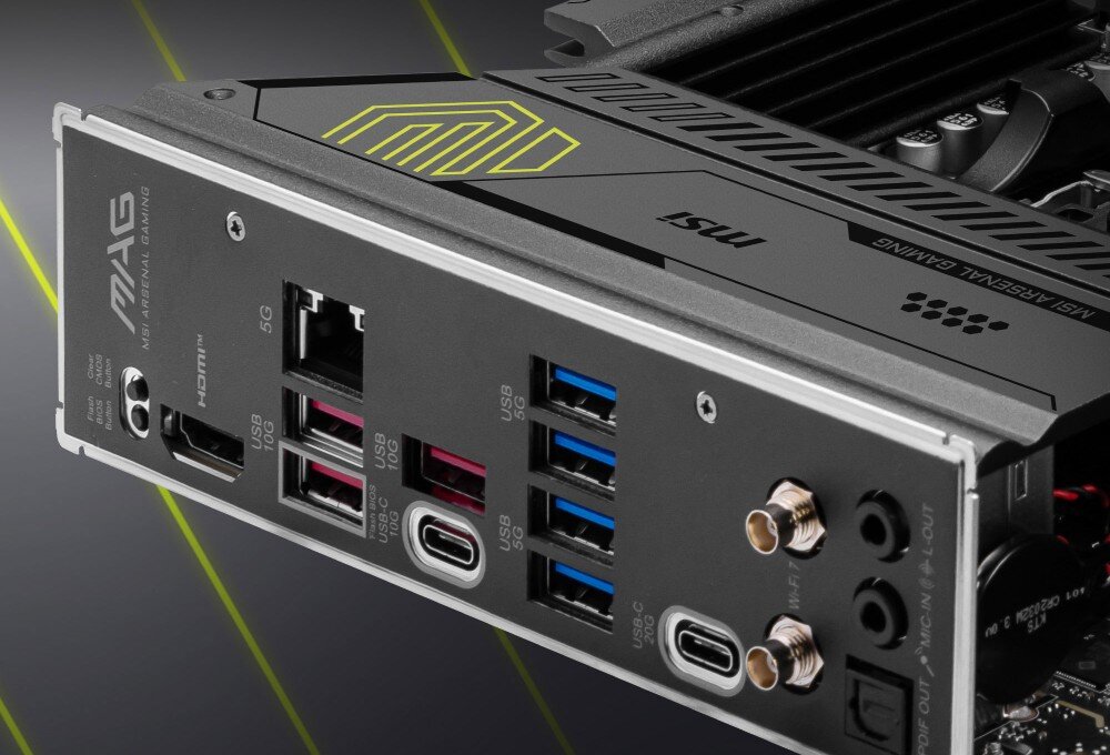 Obraz przedstawia panel tylny płyty głównej z różnymi portami, w tym USB, HDMI i Ethernet. Widoczne są napisy: \'MAG\', \'MSI\', \'HDMI\', \'5G\', \'USB\' oraz logo producenta.