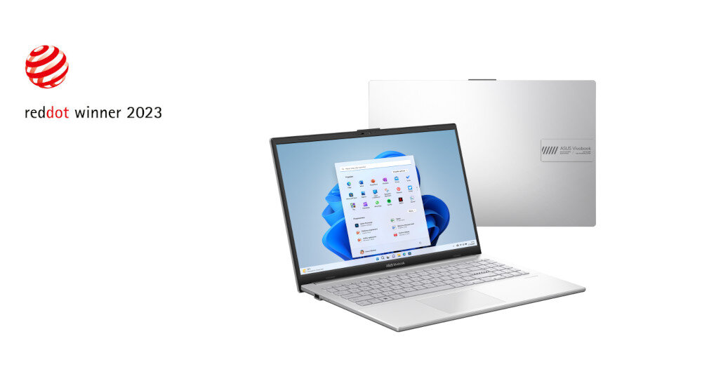 Na obrazie widoczny jest laptop z otwartym ekranem, na którym wyświetlany jest interfejs systemu Windows. Obok laptopa znajduje się zamknięta pokrywa z logo producenta, a po lewej stronie widnieje napis \'reddot winner 2023\'.