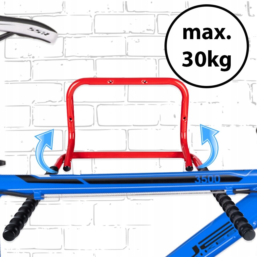 Czerwony, stalowy uchwyt rowerowy zamontowany na tle białej ceglanej ściany, z niebieskimi strzałkami wskazującymi kierunek montażu. Obok uchwytu widoczny jest napis \'max. 30kg\'.