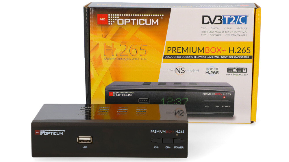 Na zdjęciu znajduje się dekoder OPTICUM Premium Box H.265 DVB-T2/HEVC/H.265 oraz jego opakowanie. Na opakowaniu widoczne są napisy: \'OPTICUM\', \'DVB T2/C\', \'H.265\', \'PREMIUMBOX+ H.265\'.
